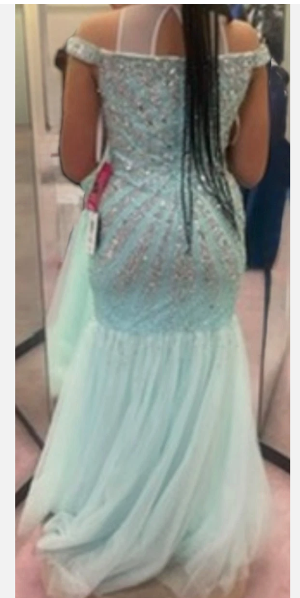dazzling entrance in this stunning mint green formal gown!