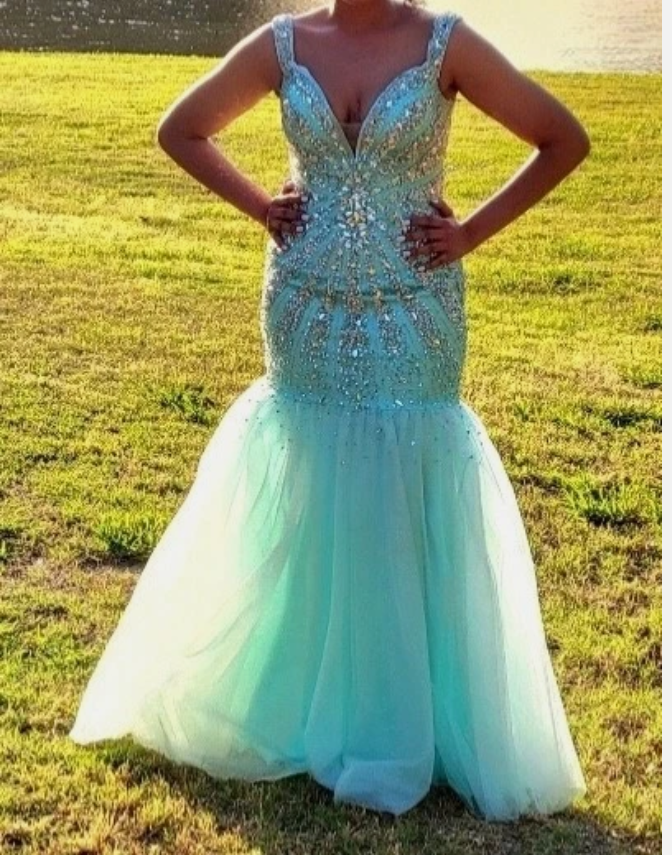 dazzling entrance in this stunning mint green formal gown!